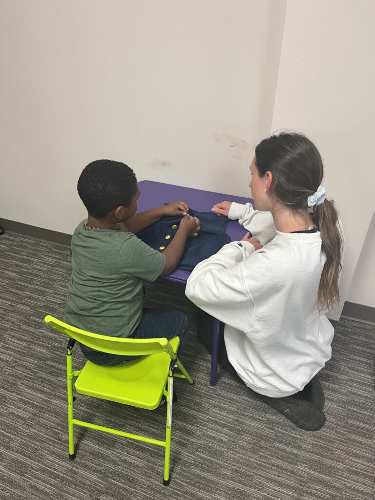 pedistric occupational therapist and a child